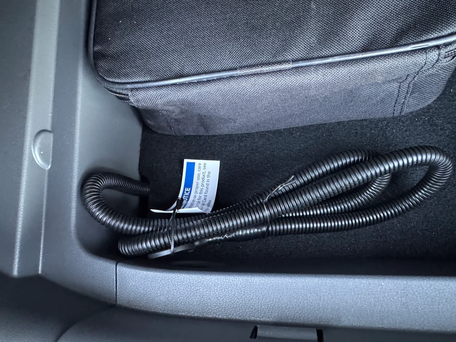 Coiled trailer wiring harness stored in the Ioniq 5 cargo area